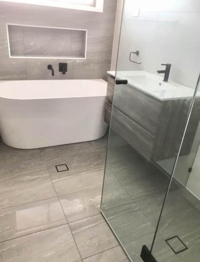 Ensuite renovation with freestanding bath and frameless glass shower